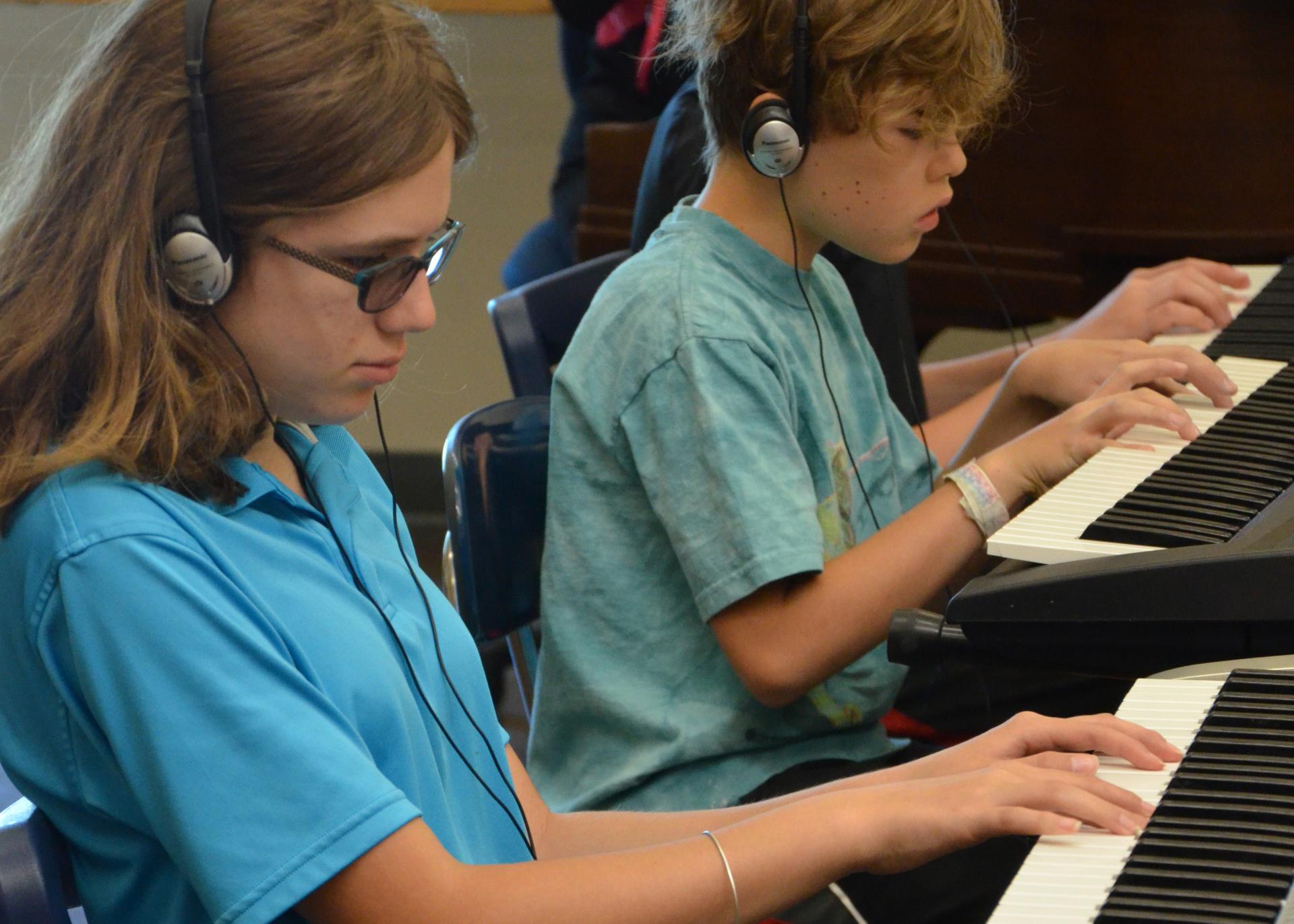 Campers playing piano